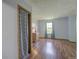 Bright bedroom with wood floors, curtains, and a dresser near the window at 9771 W Cornell Pl, Lakewood, CO 80227
