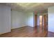 Spacious bedroom featuring wood floors, neutral paint, and closet access at 9771 W Cornell Pl, Lakewood, CO 80227