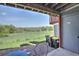 Private patio with beautiful green space and outdoor seating, ideal for relaxing and enjoying the view at 9771 W Cornell Pl, Lakewood, CO 80227