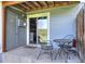 Cozy outdoor patio with seating perfect for relaxing, and sliding door to interior at 9771 W Cornell Pl, Lakewood, CO 80227