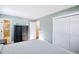 Bedroom featuring a double closet, dresser, with ensuite bathroom at 30633 Kings Valley Dr, Conifer, CO 80433