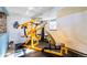 A bright exercise room that includes weight lifting and workout equipment at 30633 Kings Valley Dr, Conifer, CO 80433