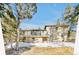 Rear view of two-story home featuring a deck and outdoor space surrounded by trees at 30633 Kings Valley Dr, Conifer, CO 80433