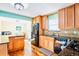 Beautiful kitchen with stainless steel appliances, wooden cabinets and an island at 30633 Kings Valley Dr, Conifer, CO 80433