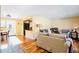 Open living space with hardwood flooring and ample sunlight at 30633 Kings Valley Dr, Conifer, CO 80433