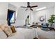 Bright bedroom with ceiling fan, large window, and comfortable seating area at 1001 E 17Th Ave # 12, Denver, CO 80218
