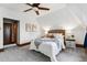 Bright bedroom featuring ceiling fan, soft carpet and cozy bed with cottage-style decor at 1001 E 17Th Ave # 12, Denver, CO 80218