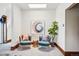 Bright bedroom featuring accent chairs, a skylight, and stylish decor at 1001 E 17Th Ave # 12, Denver, CO 80218