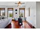 Elegant dining area featuring a glass table, hardwood floors, and natural light, perfect for entertaining guests at 1001 E 17Th Ave # 12, Denver, CO 80218