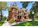 Stunning brick home boasting intricate architectural details and beautiful landscaping at 1001 E 17Th Ave # 12, Denver, CO 80218