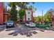 Rear exterior view of property with driveway and cars at 1001 E 17Th Ave # 12, Denver, CO 80218