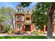 Charming red brick home with well-maintained lawn, steps leading to arched doorway at 1001 E 17Th Ave # 12, Denver, CO 80218