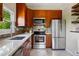 Well-equipped kitchen featuring modern appliances, ample cabinet space, and a bright window, perfect for cooking and entertaining at 1001 E 17Th Ave # 12, Denver, CO 80218