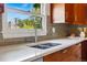 Modern kitchen featuring sleek countertops, stainless steel faucet, and tiled backsplash, perfect for culinary enthusiasts at 1001 E 17Th Ave # 12, Denver, CO 80218