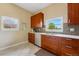 Charming kitchen with cherry cabinets, stainless steel appliances, and white countertops at 1001 E 17Th Ave # 12, Denver, CO 80218
