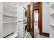 Closet featuring a stacked washer and dryer, with additional shelving space for storage at 1001 E 17Th Ave # 12, Denver, CO 80218