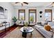 Bright living room showcasing hardwood floors, natural light, and a stylish seating arrangement, perfect for relaxation at 1001 E 17Th Ave # 12, Denver, CO 80218