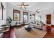 Inviting living room features hardwood floors, plenty of natural light, and ceiling fans at 1001 E 17Th Ave # 12, Denver, CO 80218
