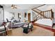Cozy living room featuring a comfortable gray sofa, jute rug, and hardwood floors, great for relaxing and entertaining at 1001 E 17Th Ave # 12, Denver, CO 80218
