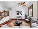 Inviting living room showcasing hardwood floors, natural light, and a stylish staircase, ideal for modern living at 1001 E 17Th Ave # 12, Denver, CO 80218
