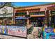 An outdoor patio with tables, chairs, and beer signs at 1001 E 17Th Ave # 12, Denver, CO 80218
