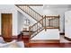 Beautiful staircase featuring wood banisters, hardwood floors, and natural light at 1001 E 17Th Ave # 12, Denver, CO 80218