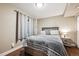 Comfortable bedroom featuring a cozy bed, modern nightstand, and bright natural lighting from the window at 10741 Idalia Way, Commerce City, CO 80022