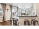 Modern kitchen with a breakfast bar, granite countertop, and stunning outdoor views at 10741 Idalia Way, Commerce City, CO 80022