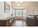 Bright living room with high ceilings, hardwood floors, and a large bay window at 10741 Idalia Way, Commerce City, CO 80022