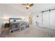 Relaxing main bedroom with a ceiling fan, neutral decor, and plush carpet at 10741 Idalia Way, Commerce City, CO 80022