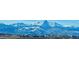 Breathtaking panoramic view of majestic snow-covered mountains and the city below at 10741 Idalia Way, Commerce City, CO 80022