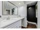 Modern bathroom with a sleek white countertop, stylish mirror, and a view of the toilet at 6800 S Pennsylvania St, Centennial, CO 80122