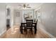 Comfortable dining space with natural light, wood floors, and a view into the kitchen at 6800 S Pennsylvania St, Centennial, CO 80122