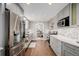 Bright kitchen featuring stainless steel appliances, subway tile backsplash, and white countertops at 6800 S Pennsylvania St, Centennial, CO 80122