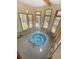 Enclosed hot tub room with multiple windows offering views of the surrounding nature at 290 Broken Lance Dr # B104, Breckenridge, CO 80424