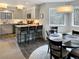 Well-lit kitchen featuring gray cabinets, modern appliances, and a breakfast bar at 290 Broken Lance Dr # B104, Breckenridge, CO 80424