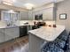 Modern kitchen with granite countertops, stainless steel appliances, and subway tile backsplash at 290 Broken Lance Dr # B104, Breckenridge, CO 80424