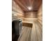This serene wooden sauna offers a tranquil retreat with comfortable seating and a classic sauna stove at 290 Broken Lance Dr # B104, Breckenridge, CO 80424