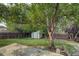 Backyard with patio, shed, and large tree at 19136 E Milan Cir, Aurora, CO 80013