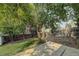 Backyard with patio, shed, and large tree at 19136 E Milan Cir, Aurora, CO 80013