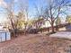 Backyard with shed, trees, and wooden fence at 19136 E Milan Cir, Aurora, CO 80013