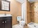 Basement bathroom with shower, toilet and vanity at 19136 E Milan Cir, Aurora, CO 80013