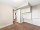 Bright basement bedroom with access to hallway and stairs at 19136 E Milan Cir, Aurora, CO 80013