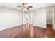 Hardwood floor bedroom with access to upper level and closet at 19136 E Milan Cir, Aurora, CO 80013