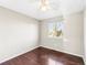 Hardwood floor bedroom with window and ceiling fan at 19136 E Milan Cir, Aurora, CO 80013