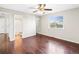 Hardwood floor bedroom with ensuite bathroom and ceiling fan at 19136 E Milan Cir, Aurora, CO 80013