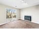 Gathering room with fireplace and sliding door to patio at 19136 E Milan Cir, Aurora, CO 80013