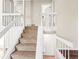 Staircase leading to upper level with white railings at 19136 E Milan Cir, Aurora, CO 80013