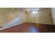 Spacious basement with wood floors, track lighting, and a small window provides lots of space at 1409 S Clermont St, Denver, CO 80222