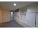 Basement storage area with lots of built-in cabinets and shelving at 1409 S Clermont St, Denver, CO 80222